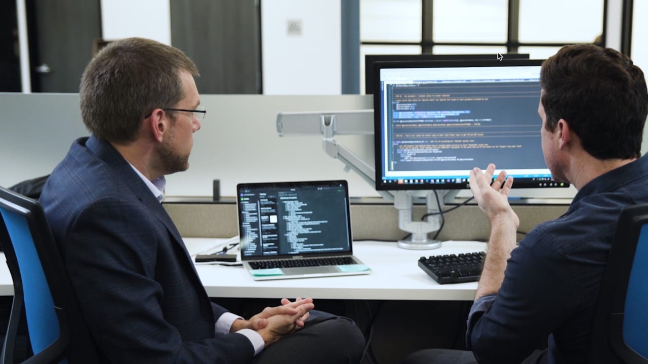Shawn Livermore reviewing React application design and implementation with client team