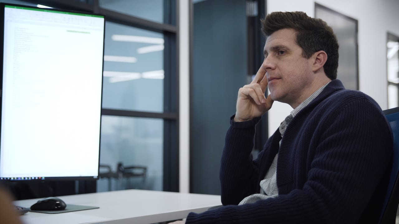 Shawn Livermore reviewing architecture at a client office