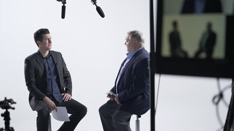 Shawn Livermore and Chad Collins discussing financial technology platform architecture in studio